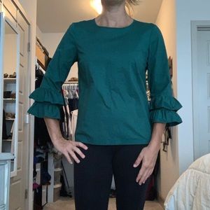 Green ruffled blouse